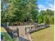 Fenced-in dog park with benches and waste disposal at 7744 Fawn Cir, Covington, GA 30014