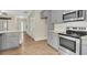 Modern kitchen with gray cabinets and stainless steel appliances at 7744 Fawn Cir, Covington, GA 30014