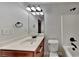 Clean bathroom with tub, toilet and vanity at 876 Nevis Way, Mcdonough, GA 30253