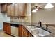 Kitchen with dark wood cabinets, granite countertops, and stainless steel appliances at 876 Nevis Way, Mcdonough, GA 30253