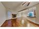 Living room with hardwood floors, fireplace, and open floor plan at 876 Nevis Way, Mcdonough, GA 30253