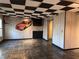 Finished basement with slate floor and racing theme decor at 234 Lake Ruby Dr, Suwanee, GA 30024