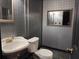Basement bathroom with gray tile and pedestal sink at 234 Lake Ruby Dr, Suwanee, GA 30024