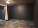 Finished basement room with dark gray textured walls at 234 Lake Ruby Dr, Suwanee, GA 30024