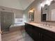 Bathroom with double vanity, soaking tub, and walk-in shower at 234 Lake Ruby Dr, Suwanee, GA 30024