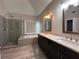 Bathroom with double vanity, soaking tub, and walk-in shower at 234 Lake Ruby Dr, Suwanee, GA 30024