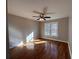Bright bedroom with hardwood floors and window at 234 Lake Ruby Dr, Suwanee, GA 30024