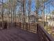 Deck overlooking wooded area with distant home views at 234 Lake Ruby Dr, Suwanee, GA 30024