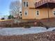 Stone fire pit area with seating and gravel landscaping at 234 Lake Ruby Dr, Suwanee, GA 30024