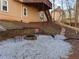 Stone fire pit area with seating and gravel landscaping at 234 Lake Ruby Dr, Suwanee, GA 30024