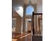 Bright two story foyer with hardwood floors and chandelier at 234 Lake Ruby Dr, Suwanee, GA 30024