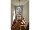 Bright two story foyer with hardwood floors and chandelier at 234 Lake Ruby Dr, Suwanee, GA 30024