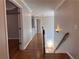 Upper hallway with hardwood floors and access to bedrooms at 234 Lake Ruby Dr, Suwanee, GA 30024