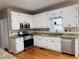 Kitchen boasts granite countertops and stainless steel appliances at 234 Lake Ruby Dr, Suwanee, GA 30024