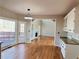 Kitchen with granite countertops, white cabinets, and access to deck at 234 Lake Ruby Dr, Suwanee, GA 30024