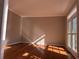 Spacious living room with hardwood floors and large windows at 234 Lake Ruby Dr, Suwanee, GA 30024
