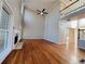 Two-story living room with hardwood floors, fireplace, and access to balcony at 234 Lake Ruby Dr, Suwanee, GA 30024