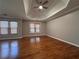 Spacious main bedroom with hardwood floors and tray ceiling at 234 Lake Ruby Dr, Suwanee, GA 30024