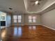 Spacious main bedroom with hardwood floors and tray ceiling at 234 Lake Ruby Dr, Suwanee, GA 30024