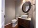 Updated powder room with vessel sink, modern vanity, and elegant mirror at 234 Lake Ruby Dr, Suwanee, GA 30024