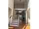 Two story foyer with hardwood floors and wooden staircase at 234 Lake Ruby Dr, Suwanee, GA 30024