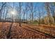 A wooded backyard provides privacy and seclusion at 2400 Stedman Sw Ln, Conyers, GA 30094