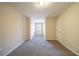 Empty bedroom with neutral colored carpet and walls, and a window at 2400 Stedman Sw Ln, Conyers, GA 30094