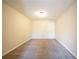 Neutral carpeted room with fresh cream colored walls and white door at 2400 Stedman Sw Ln, Conyers, GA 30094