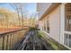A wooden deck overlooks the scenic and lush backyard at 2400 Stedman Sw Ln, Conyers, GA 30094