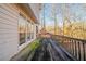 A wooden deck offers a peaceful view of the wooded area behind the property at 2400 Stedman Sw Ln, Conyers, GA 30094