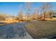 Elegant brick homes line a driveway amid a picturesque landscape with mature trees at 2400 Stedman Sw Ln, Conyers, GA 30094