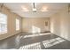 A two-car garage features an exterior door and plenty of space for storage at 2400 Stedman Sw Ln, Conyers, GA 30094