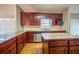 Kitchen featuring stainless steel appliances, an island, and granite countertops at 2400 Stedman Sw Ln, Conyers, GA 30094