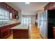 Kitchen featuring stainless steel appliances, an island, and hardwood floors at 2400 Stedman Sw Ln, Conyers, GA 30094
