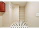 A well-organized pantry features wire shelving and unique patterned flooring at 2400 Stedman Sw Ln, Conyers, GA 30094