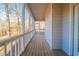 A screened-in porch offers an outdoor space with views of the wooded backyard at 2400 Stedman Sw Ln, Conyers, GA 30094