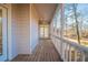 The screened porch includes a ceiling fan and provides scenic backyard views at 2400 Stedman Sw Ln, Conyers, GA 30094