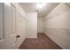 Walk-in closet with carpeted floors and metal shelving for storage at 2400 Stedman Sw Ln, Conyers, GA 30094