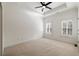 Spacious bedroom with tray ceiling, ceiling fan, and white plantation shutters on the windows at 3245 Buckhead Forest Ne Mews, Atlanta, GA 30305