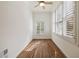 Bright bedroom featuring hardwood floors, plantation shutters, and a ceiling fan at 3245 Buckhead Forest Ne Mews, Atlanta, GA 30305