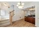 Dining area features hardwood floors, and is adjacent to the modern kitchen at 3245 Buckhead Forest Ne Mews, Atlanta, GA 30305