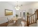 Dining room features a round table with seating for four, next to a staircase at 3245 Buckhead Forest Ne Mews, Atlanta, GA 30305