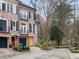 Charming brick townhome featuring black shutters, balconies, and colorful front doors at 3245 Buckhead Forest Ne Mews, Atlanta, GA 30305