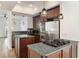 Modern kitchen features stainless steel appliances, dark cabinetry, and granite countertops at 3245 Buckhead Forest Ne Mews, Atlanta, GA 30305