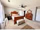 Main bedroom featuring a wooden bed frame and ample closet space at 5485 Mountain Top Pl, Cumming, GA 30041