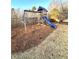 playset with swings and slide in backyard at 5485 Mountain Top Pl, Cumming, GA 30041