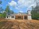 New construction home with covered patio and wooded backyard at 6851 Phillips Mill Rd, Douglasville, GA 30135