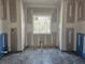 Bathroom with gray tiled floors and a window providing natural light at 6851 Phillips Mill Rd, Douglasville, GA 30135