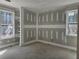 Bedroom with two windows, gray walls, white trim, and built-in shelving at 6851 Phillips Mill Rd, Douglasville, GA 30135