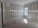 This unfinished bedroom has a door and a window at 6851 Phillips Mill Rd, Douglasville, GA 30135